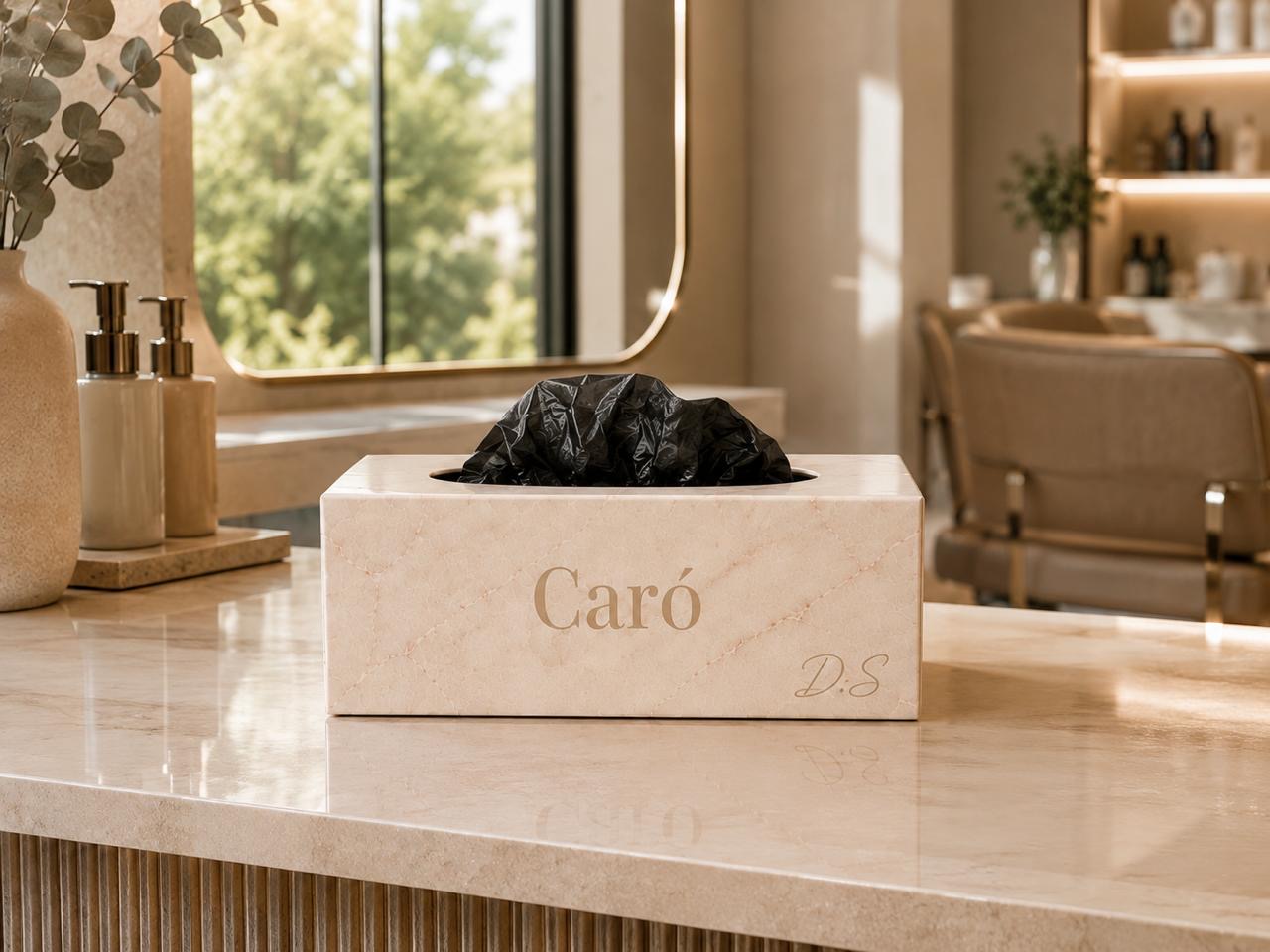 A marble-look CARÓ glove box on a bright salon counter